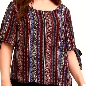 Torrid “Boho print chiffon tie sleeve.”